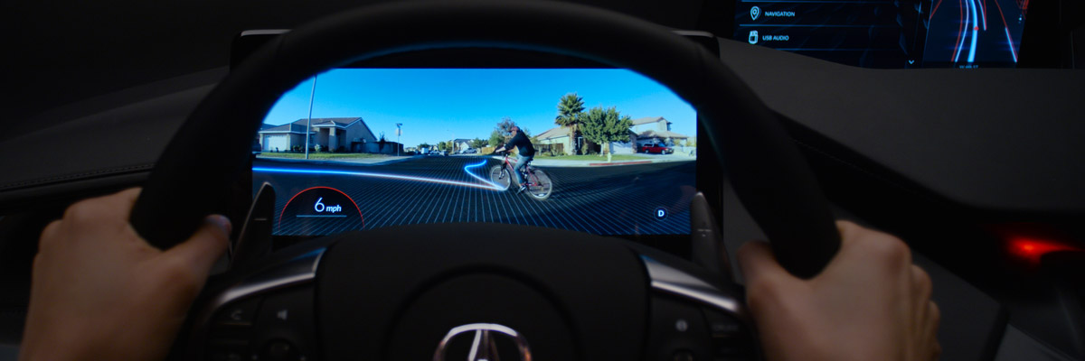 Screen behind steering wheel